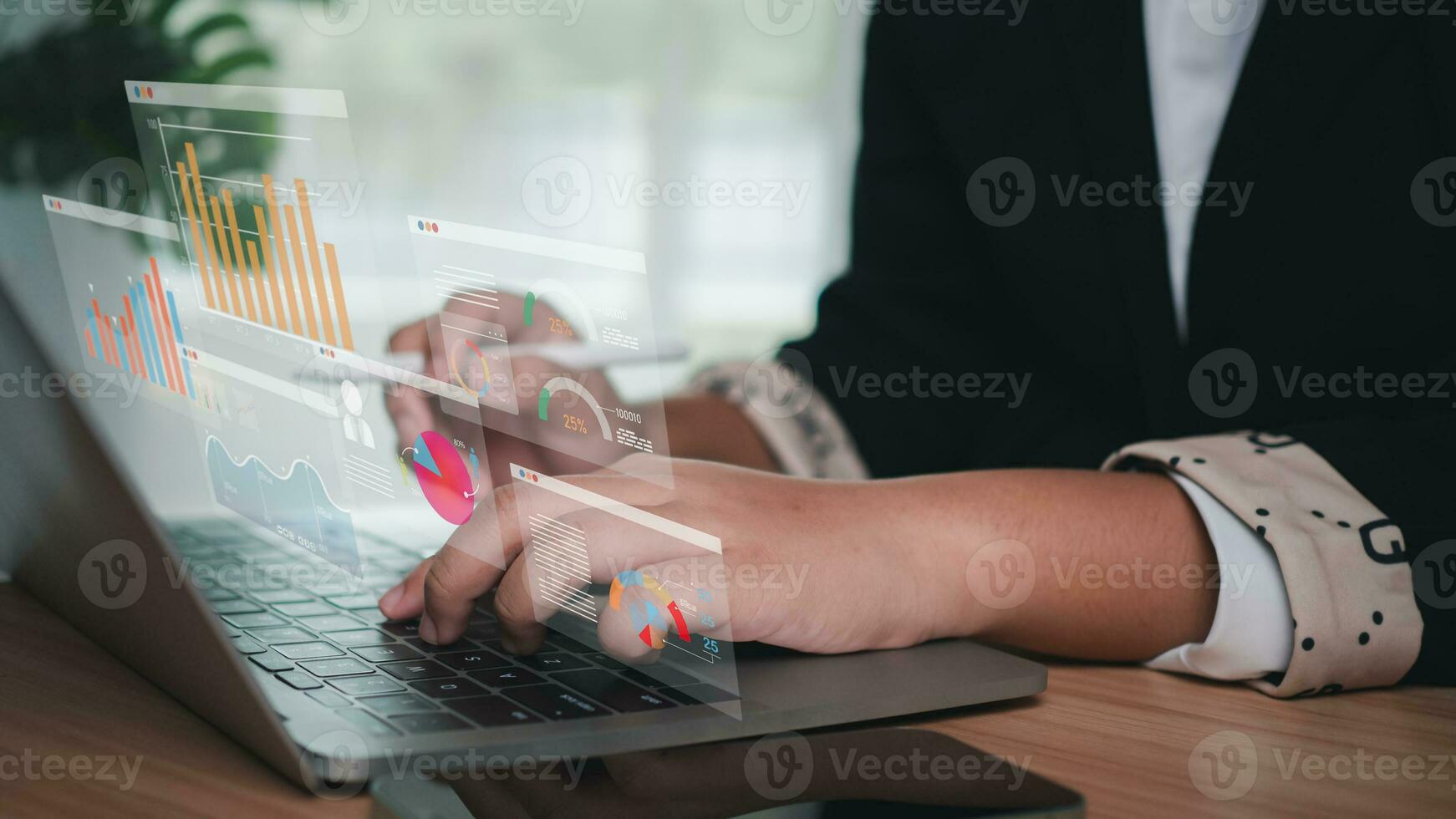 Business women use computers to analyze business and manage business data analysis as well as corporate data analysis with charts and indicators. photo