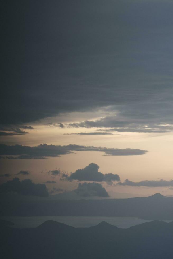 clouds over the sky by sunset photo