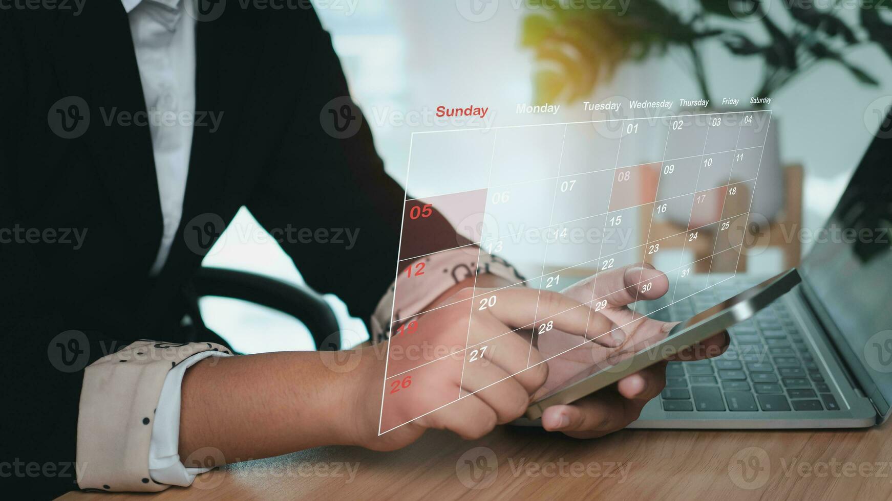 Businesswoman marking dates on virtual calendar, managing his business schedule, setting reminders for important appointments, creative collage for planning ideas, appointment scheduler photo