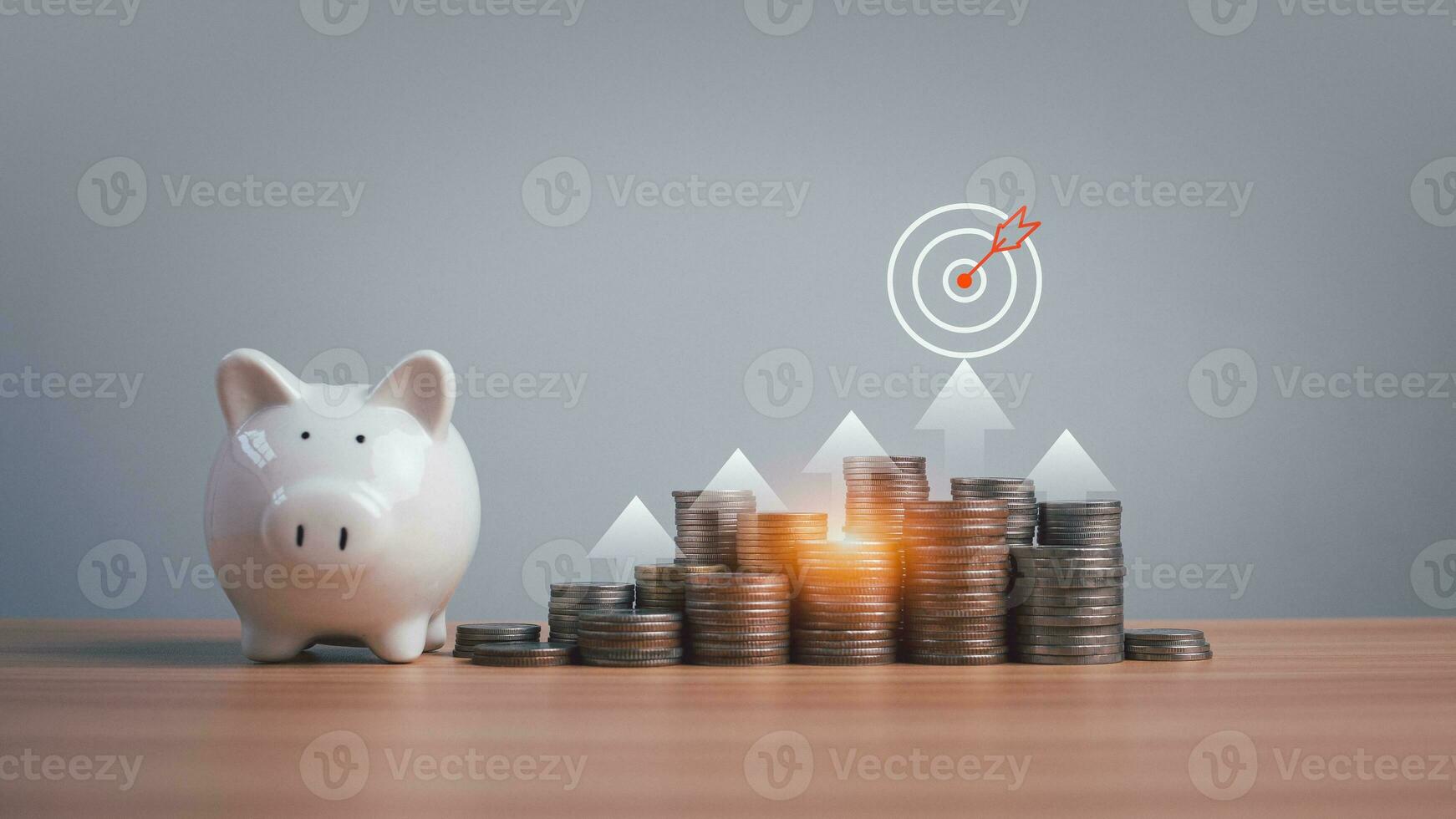 Piggy bank and coins lined up on a wooden background with target icons on a white background. Financial concepts, savings and investments photo