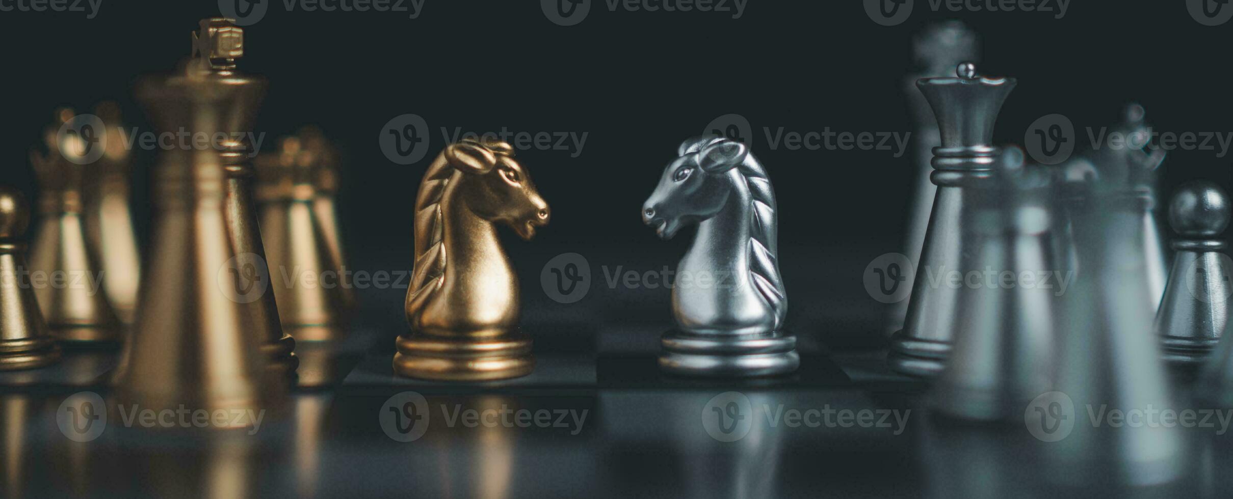 Gold and silver chess pieces in chess board game for business comparison. Leadership concepts, human resource management concepts. photo