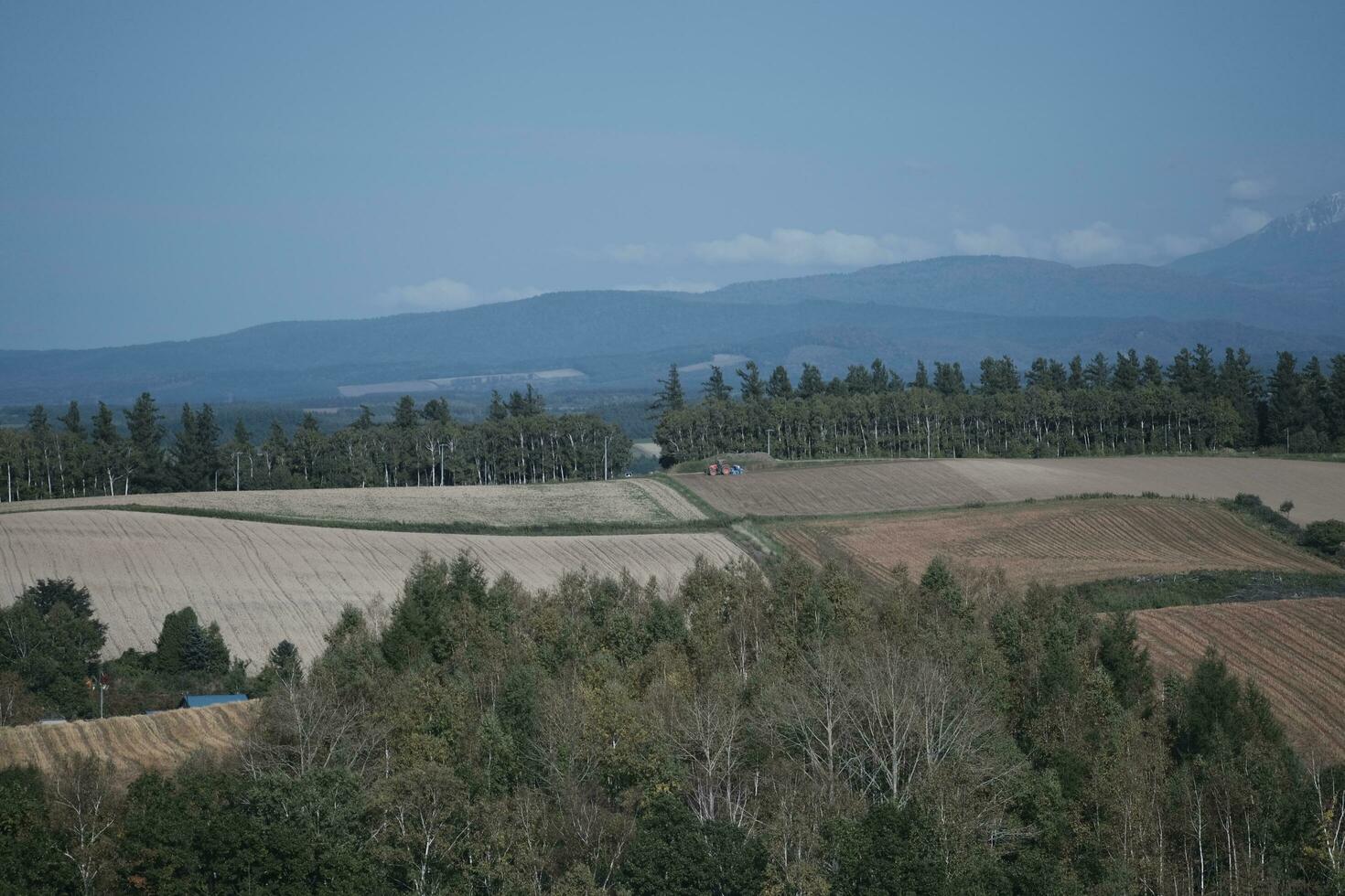 clouds over the mountains and farms photo