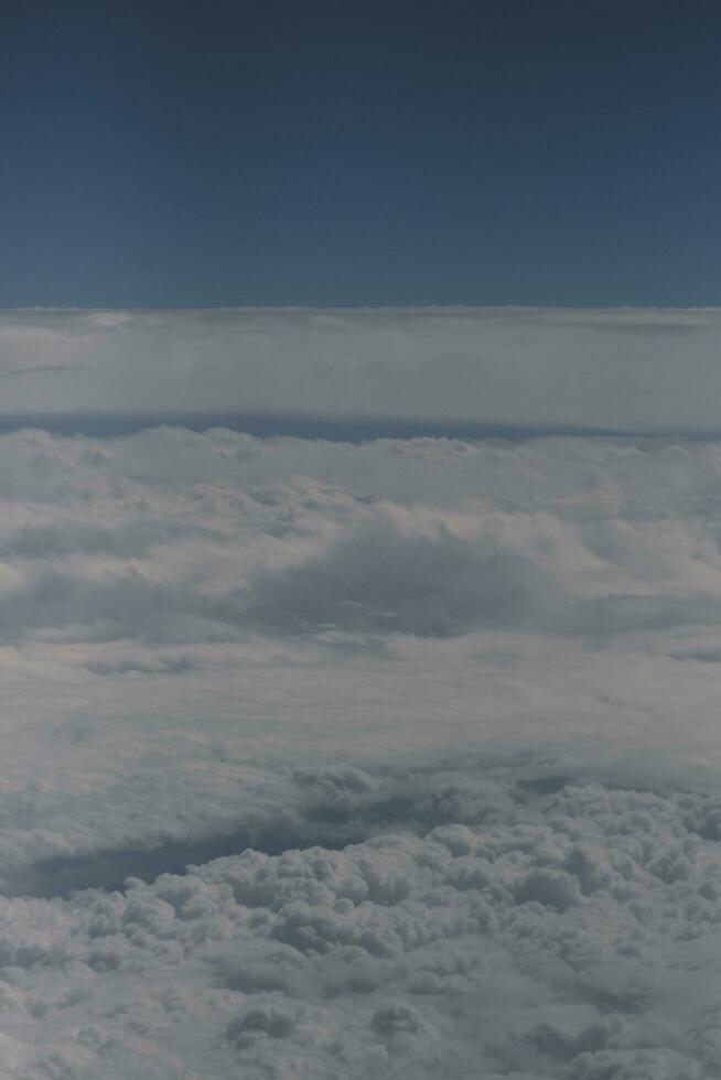 clouds over the sky and sea photo