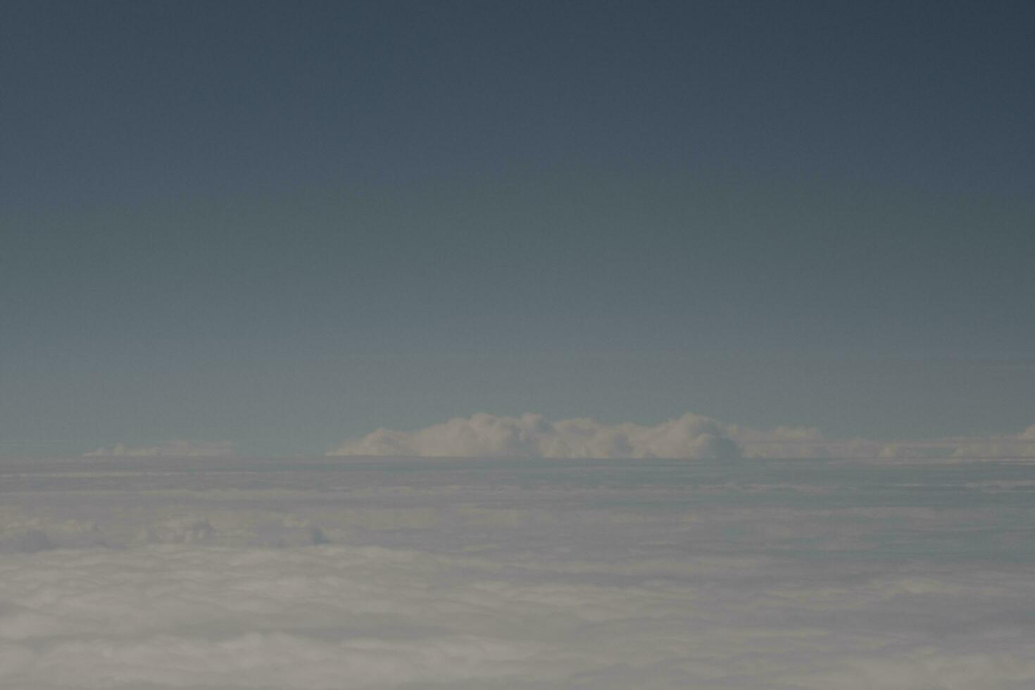 clouds over the sky and sea photo