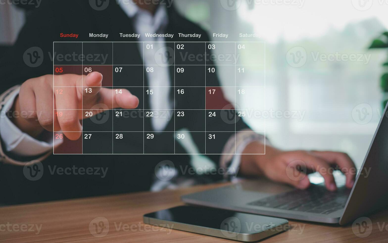 Businesswoman marking dates on virtual calendar, managing his business schedule, setting reminders for important appointments, creative collage for planning ideas, appointment scheduler photo