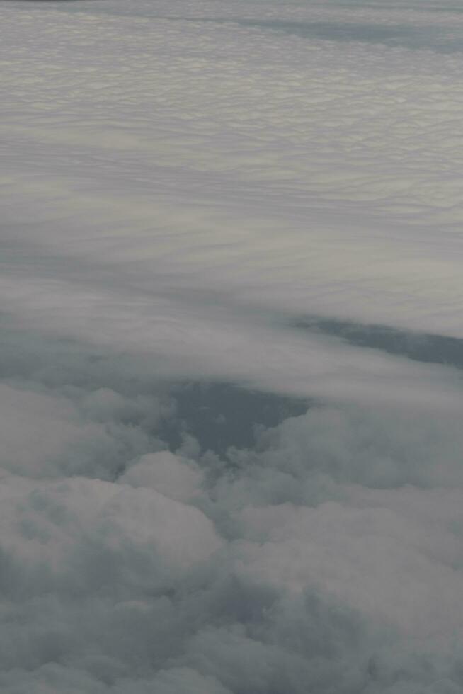 clouds over the sky and sea photo
