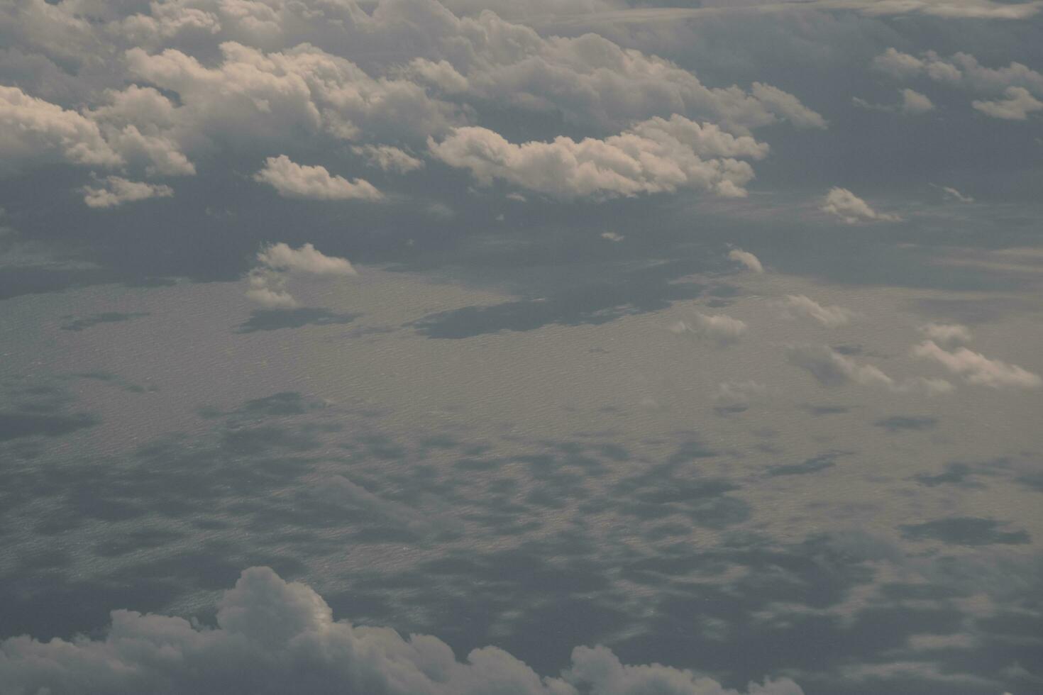 clouds over the sky and sea photo