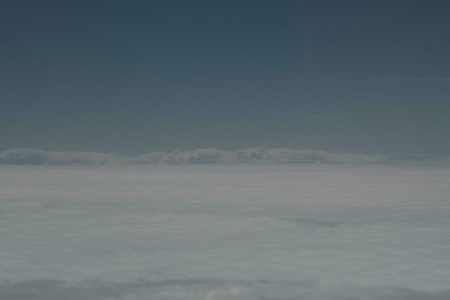 clouds over the sky and sea photo