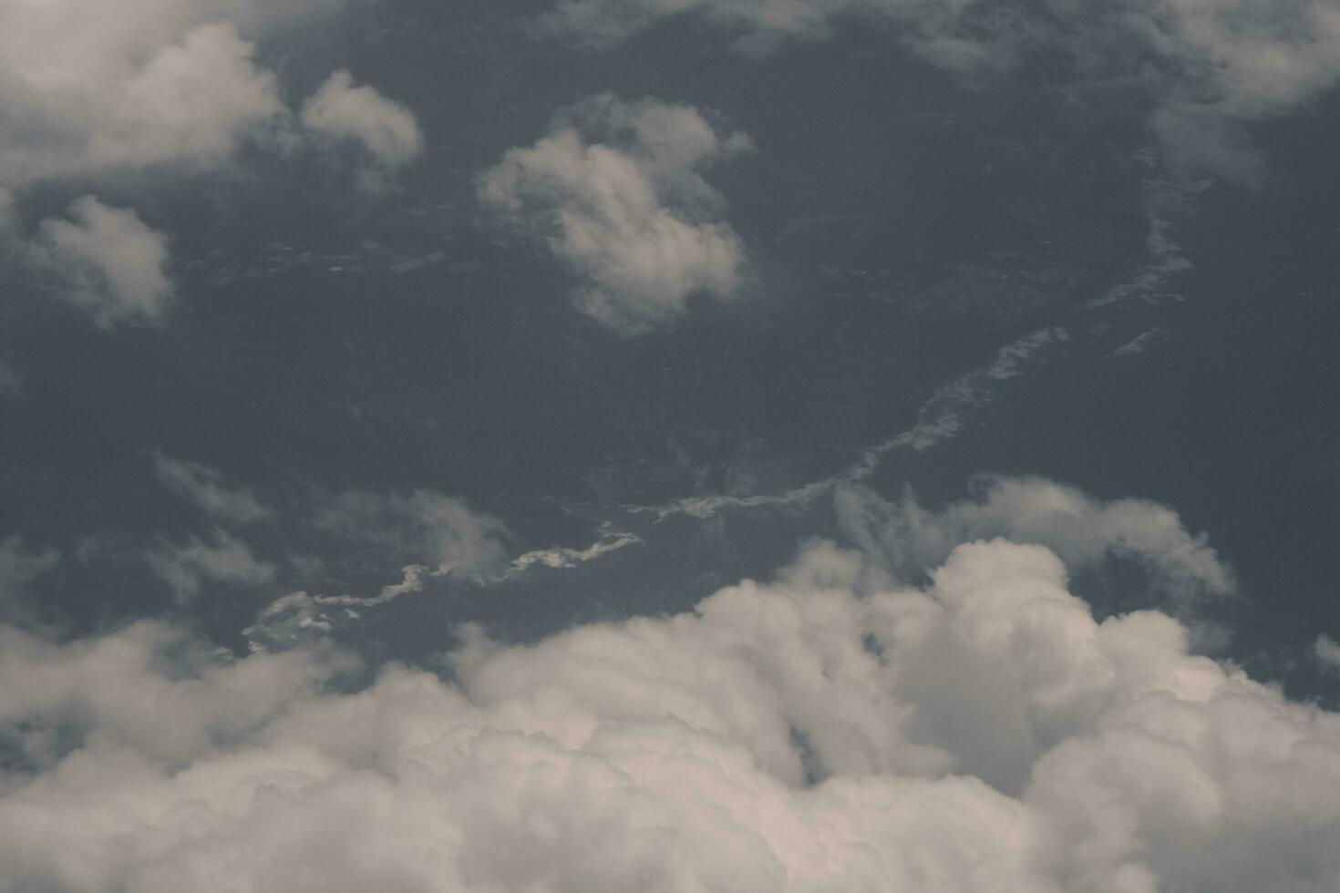 clouds over the sky and sea photo