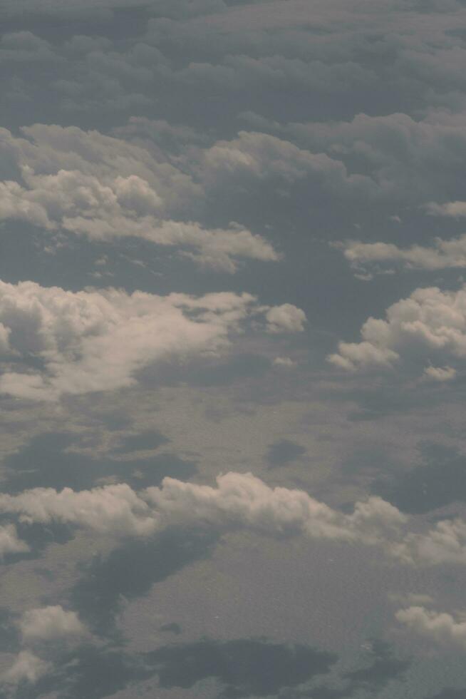 clouds over the sky and sea photo