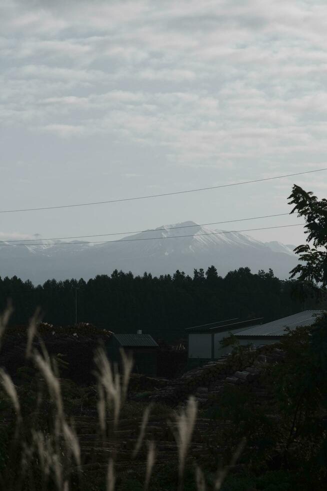 clouds over the mountains and farms photo