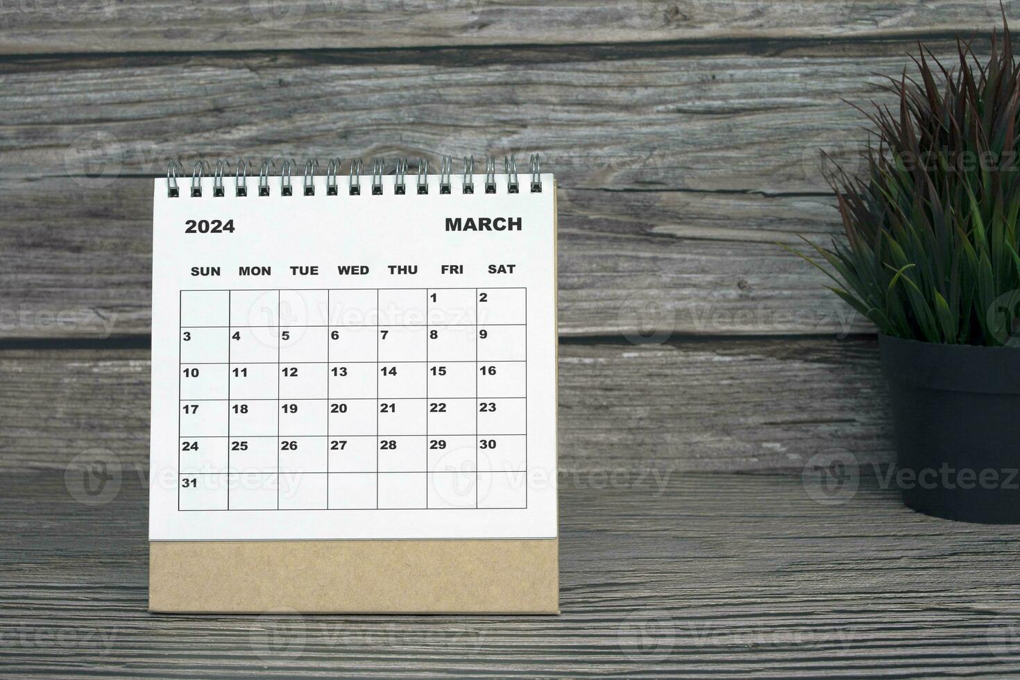 White March 2024 calendar on wooden desk. 2024 New Year Concept photo