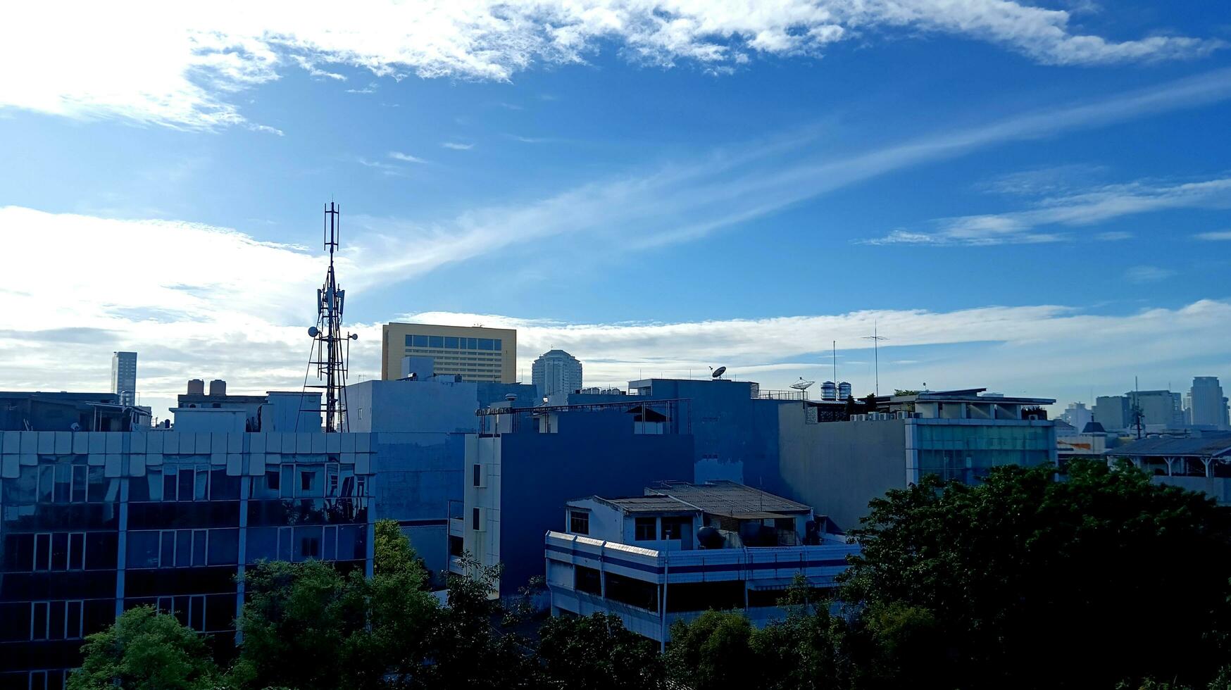 a landscape of city view with esthetic sky photo