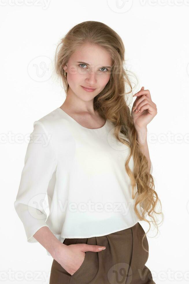 Portrait charismatic young woman staring camera. Well-dressed Caucasian blonde female 21 years old photo