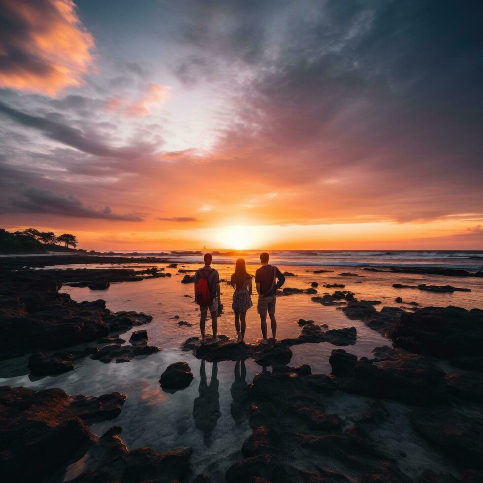 Captivating image of a group of travelers standing in awe of a stunning sunset photo