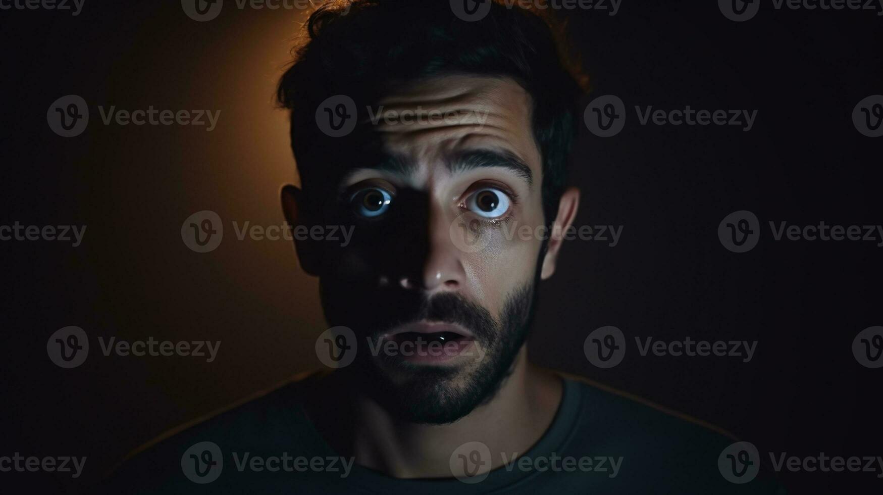 Scared Man Looking at the Camera Isolated on the Minimalist Background photo