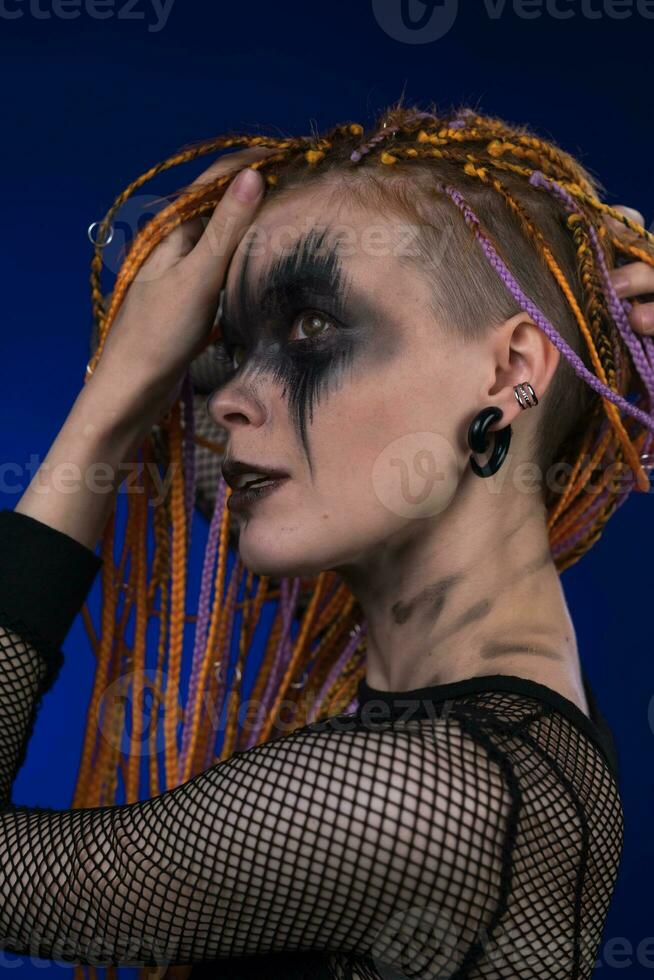 Dramatic portrait of young female with spooky stage makeup painted on face  and dreadlocks hairstyle 32500542 Stock Photo at Vecteezy