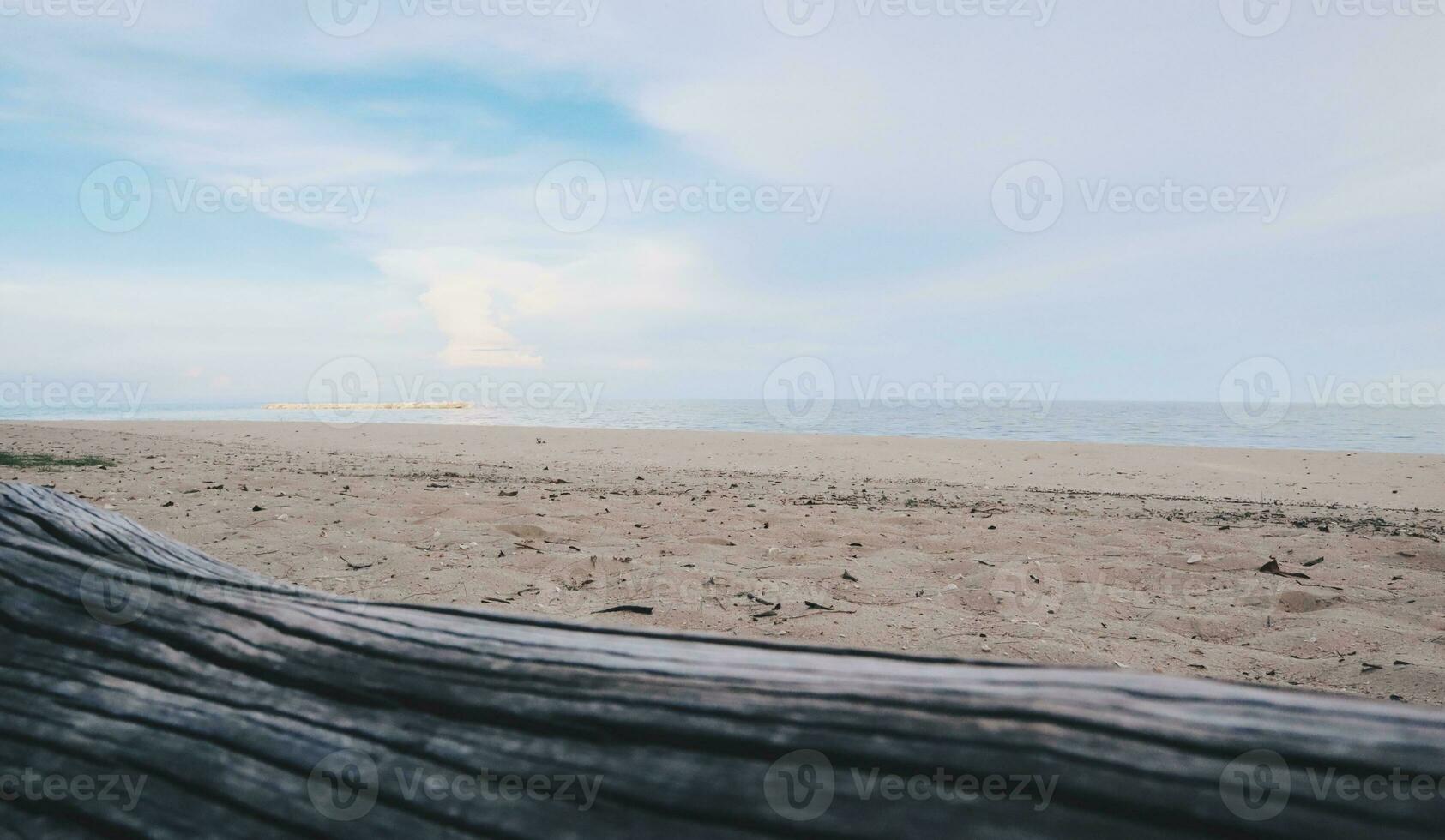 wooden table with sea, beach and blue sky background for product display photo