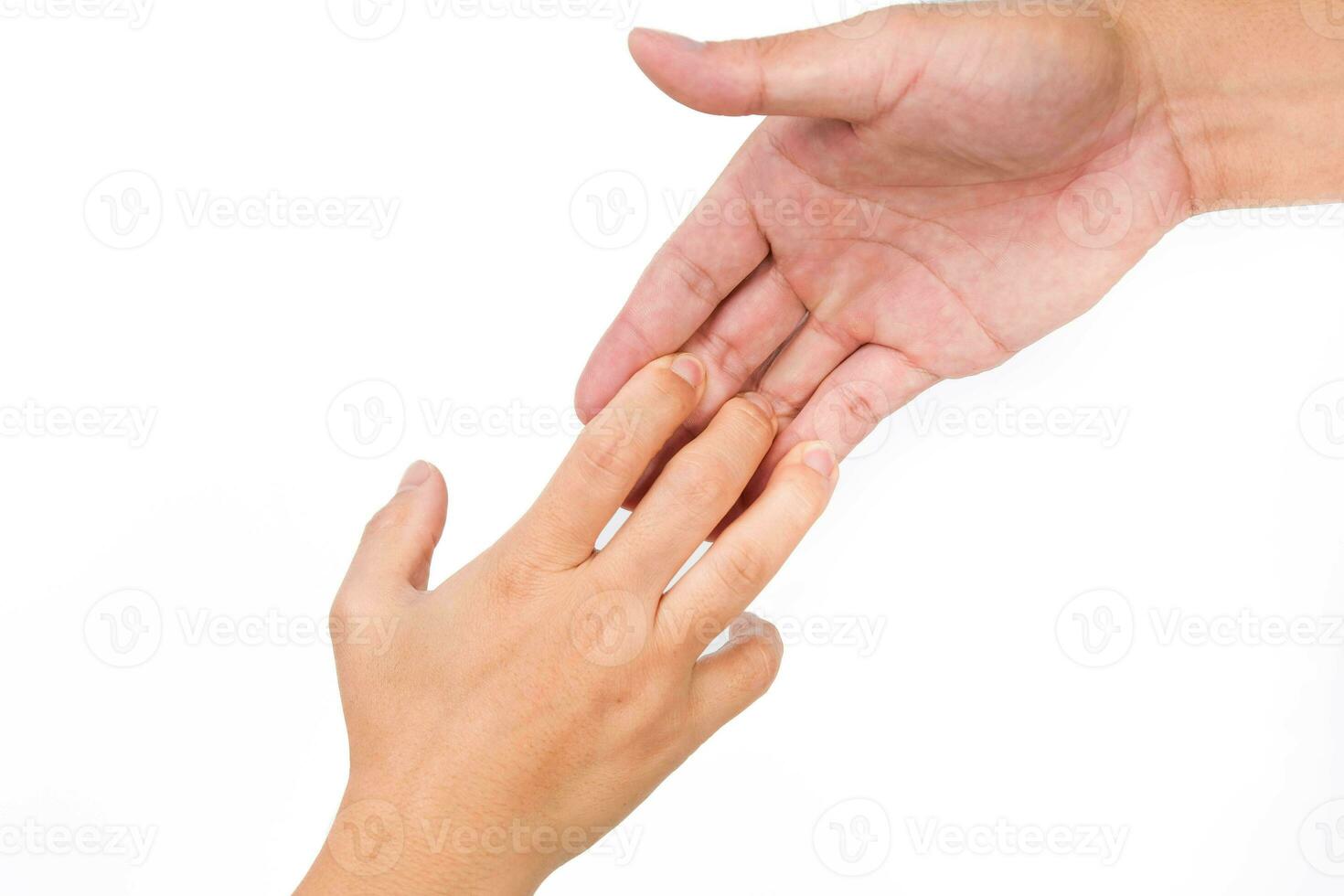 Hands of man and woman reaching to each other. Two people holding hands on white background. That can mean helping, caring, protecting, loving, caring and world peace concept. photo