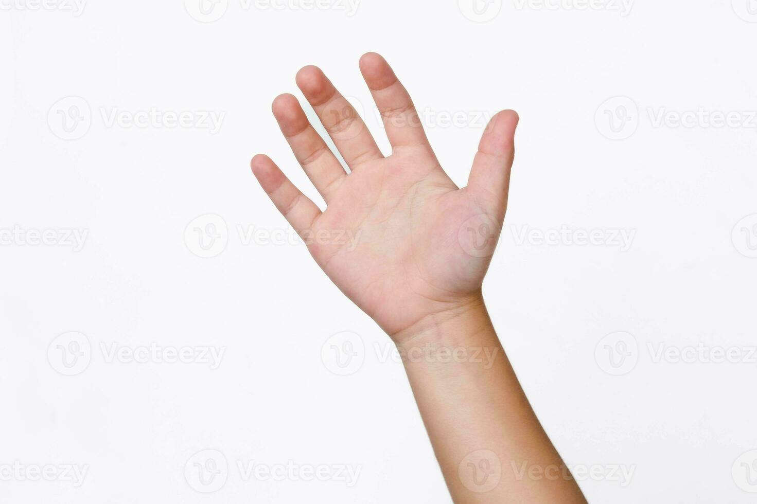 Child hand reaching up ready to help or receive isolated on white background. Helping hand outstretched for salvation. photo
