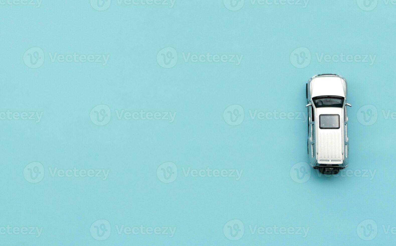 Car model isolated on blue background, after some edits. photo