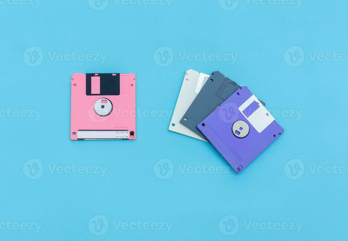 Floppy disks isolated on blue background. After some edits. photo