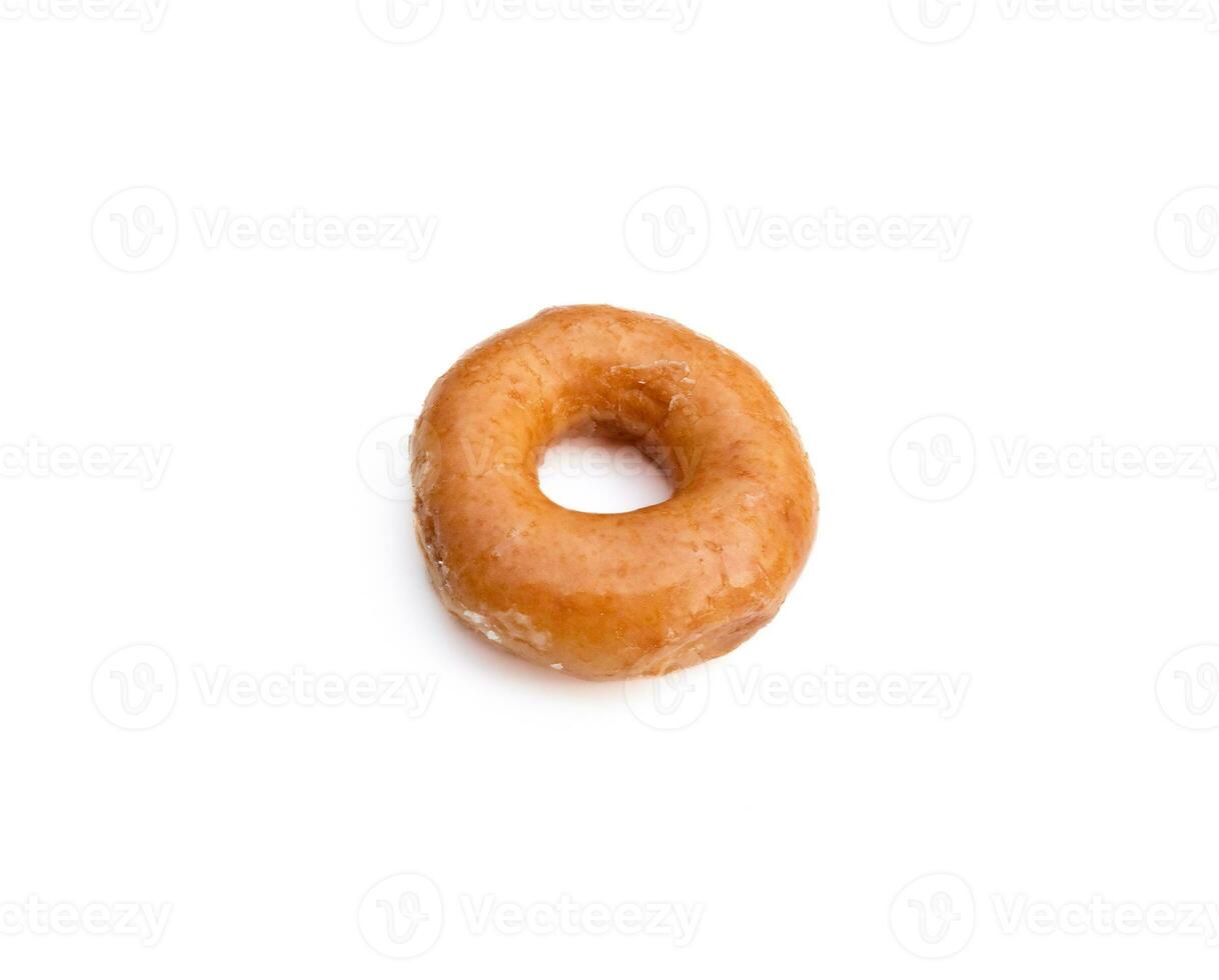 Glazed donut isolated on white background. After some edits. photo