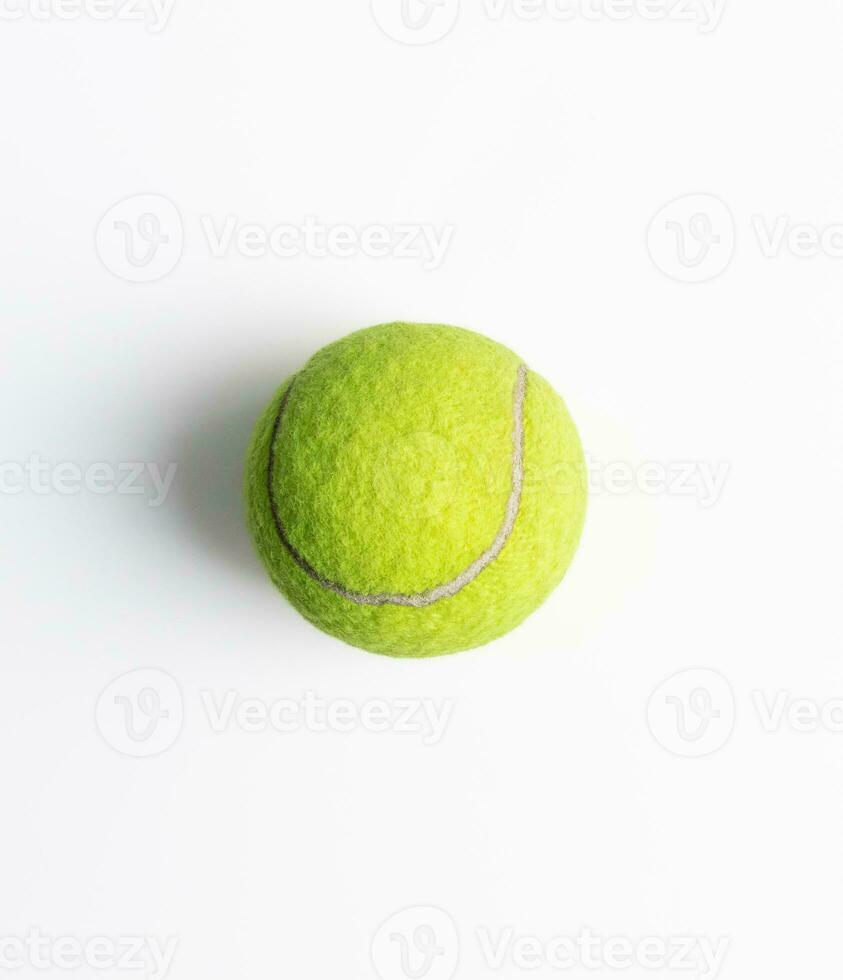 A tennis ball isolated on white background, after some edits. photo