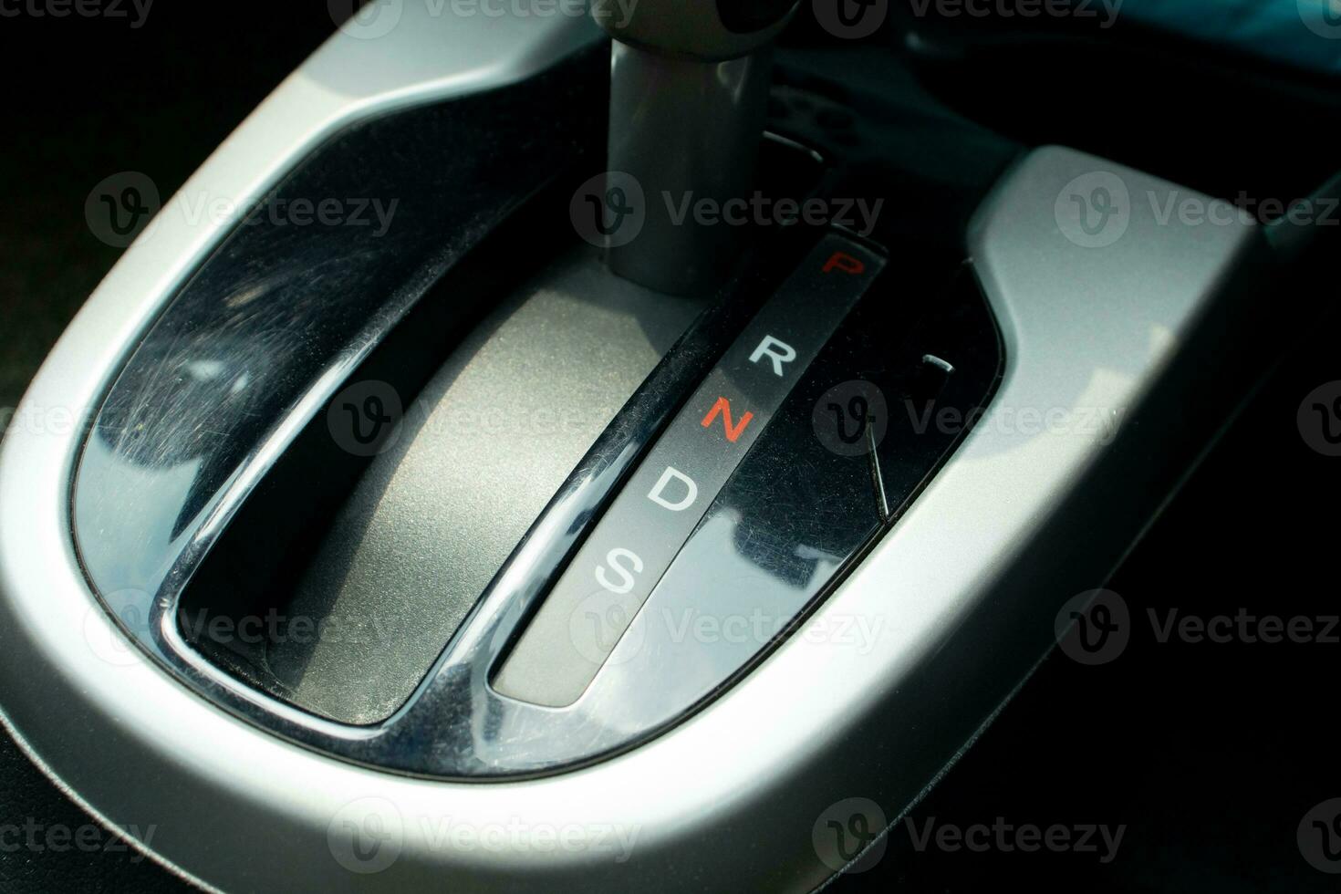 Close up photo of gear shift in a car, after some edits.