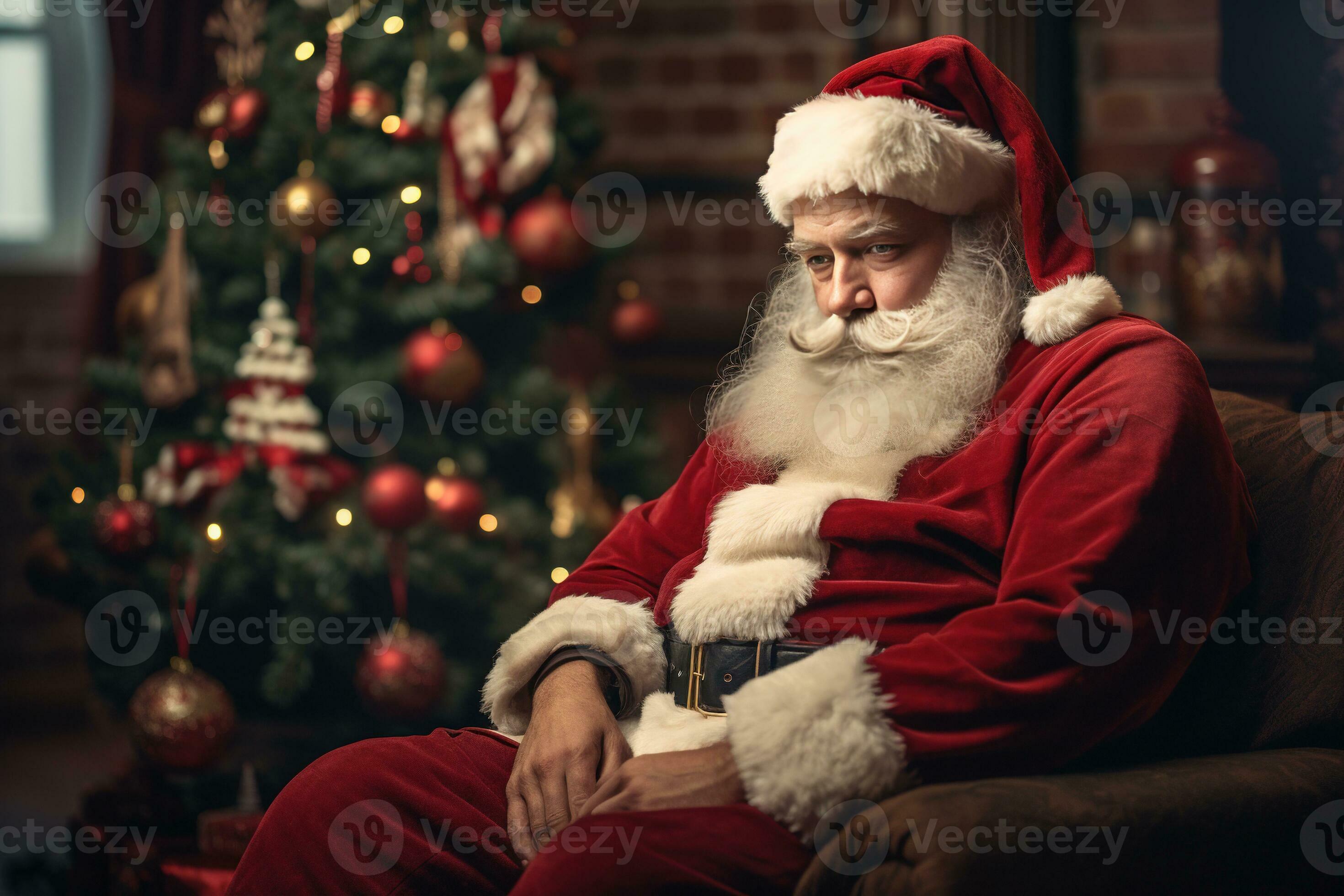Sad Santa Claus sitting on the background of a Christmas tree