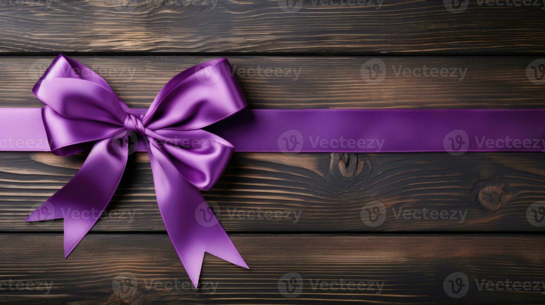 Purple ribbon on a rustic table background with empty space for text photo