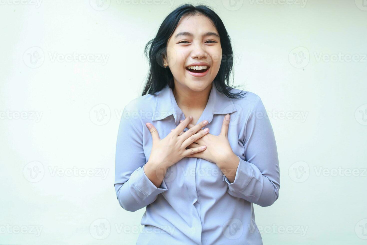 delighted asian business woman laughing surprised for good achievement looking at camera with hand on chest wear formal shirt standing isolated over white background, successful entrepreneur photo