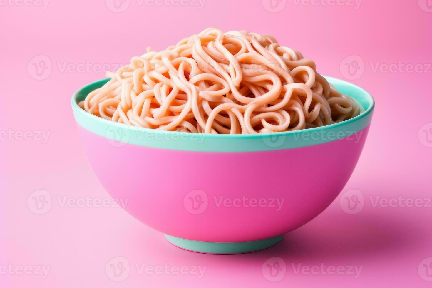 Bright color changing noodles in bowl isolated on a pink gradient background photo