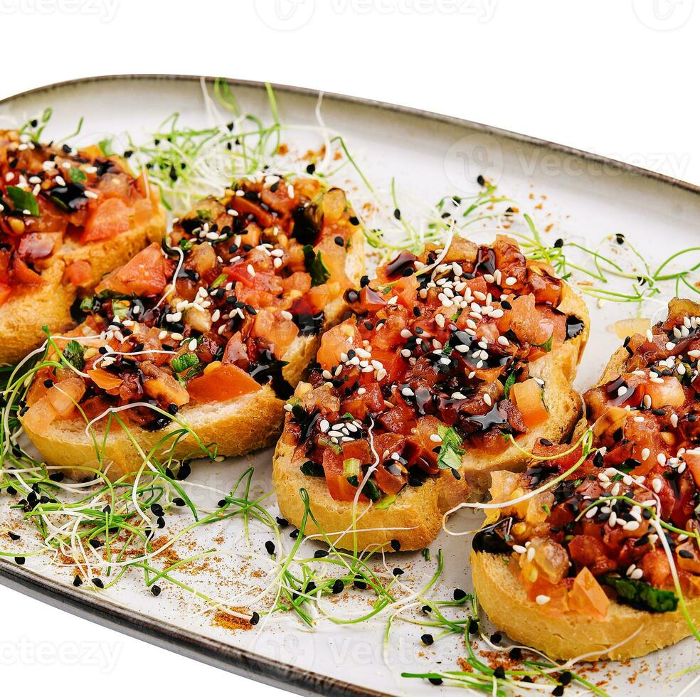 italian appetizing bruschetta with tomato on plate photo