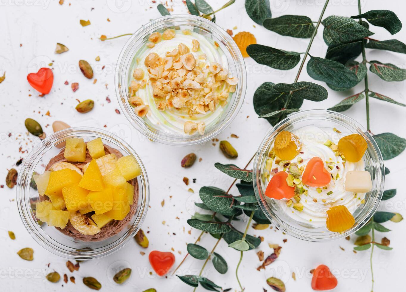 Soft chocolate and vanilla ice cream with pistachio, mango and jelly photo