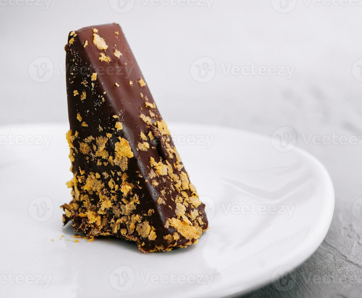 Waffle cake in chocolate glaze isolated on white background photo