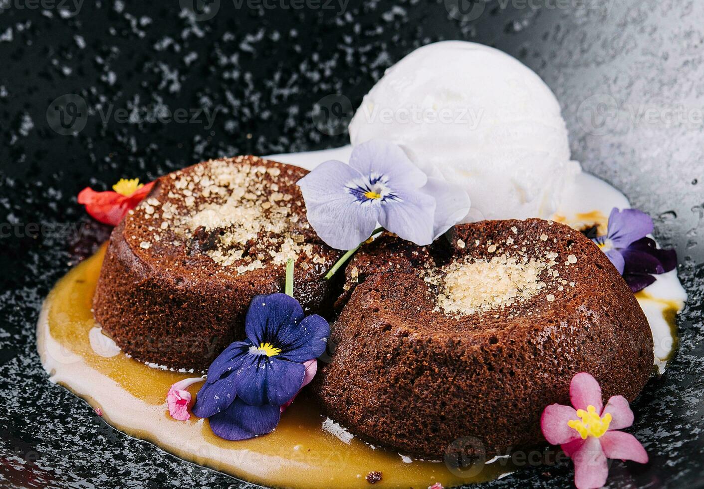 Chocolate lava cake with ice cream served on plate photo