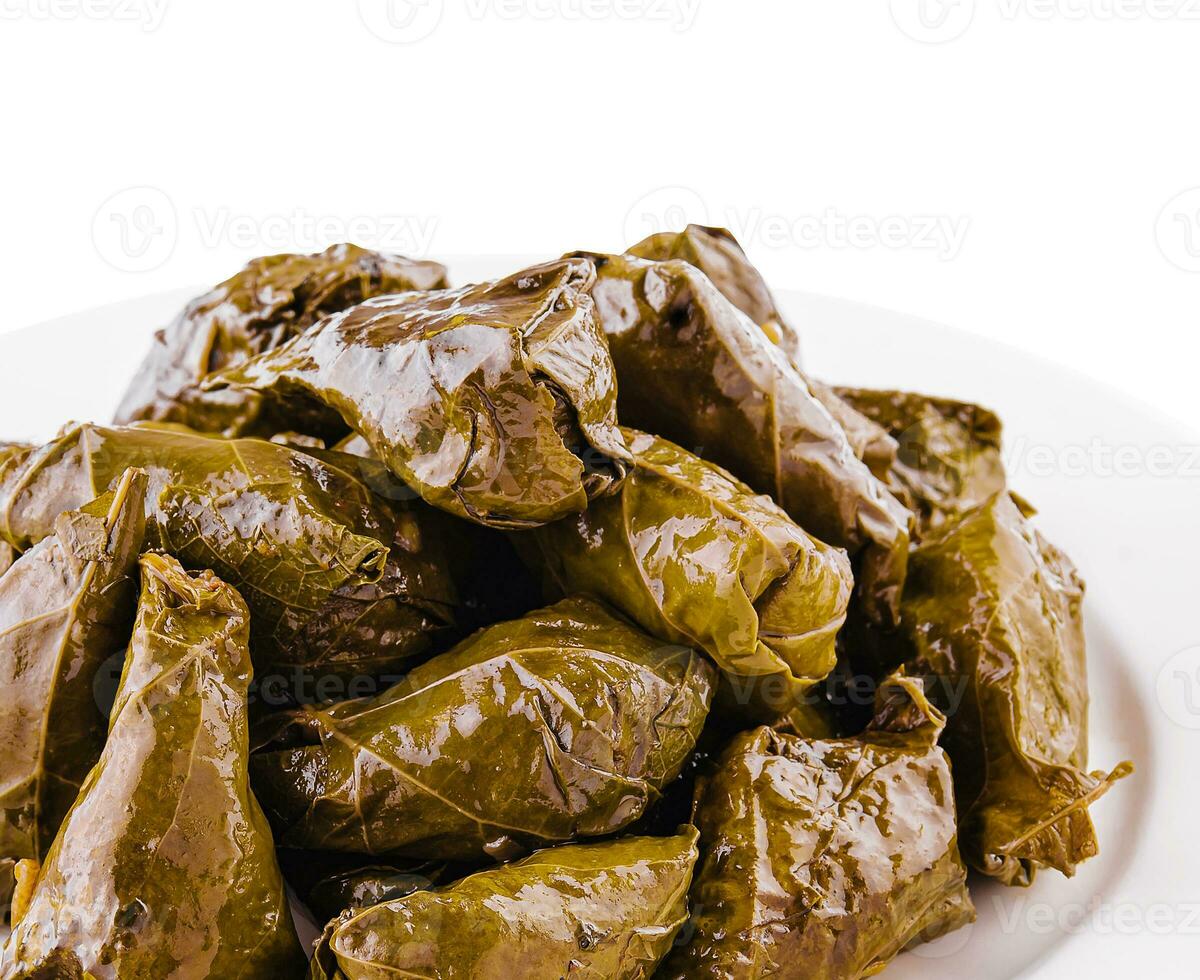 rice wrapped in grape leaves on plate 32621108 Stock Photo at Vecteezy