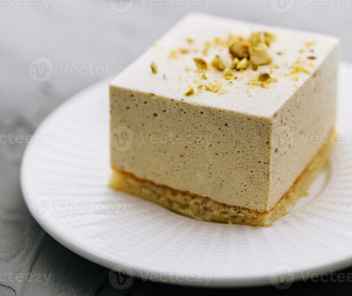 Souffle cake with nuts on plate photo