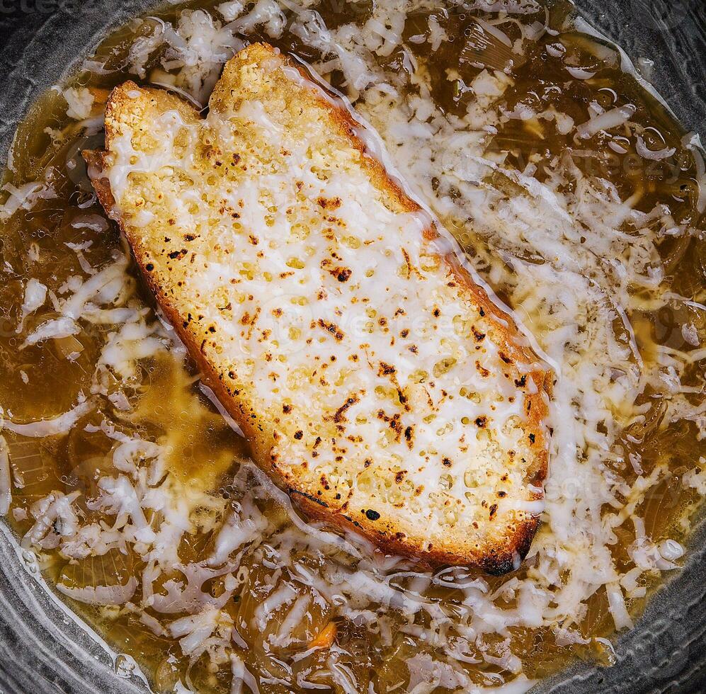 Tasty french onion soup in bowl photo