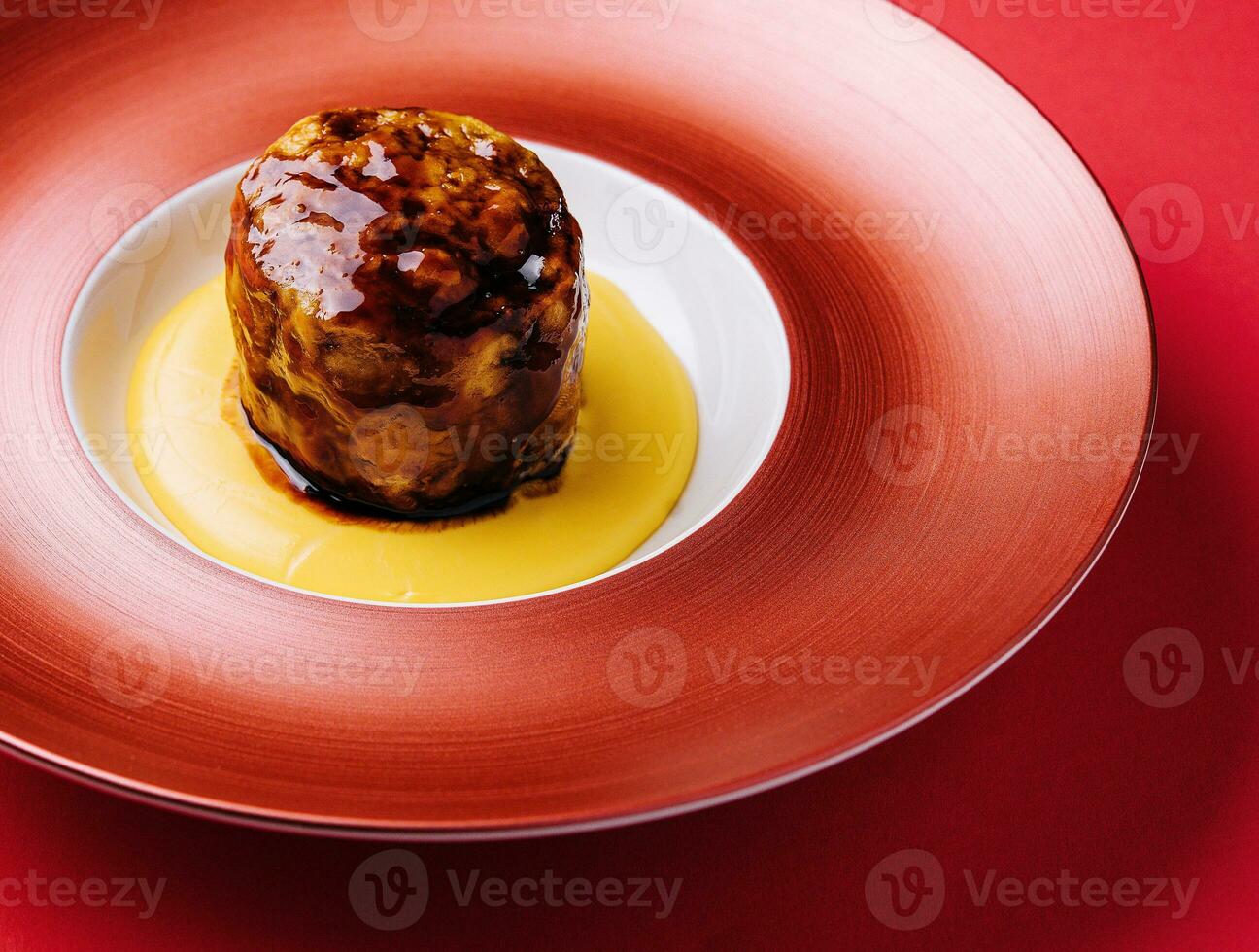 Beef medallion steak on red plate photo