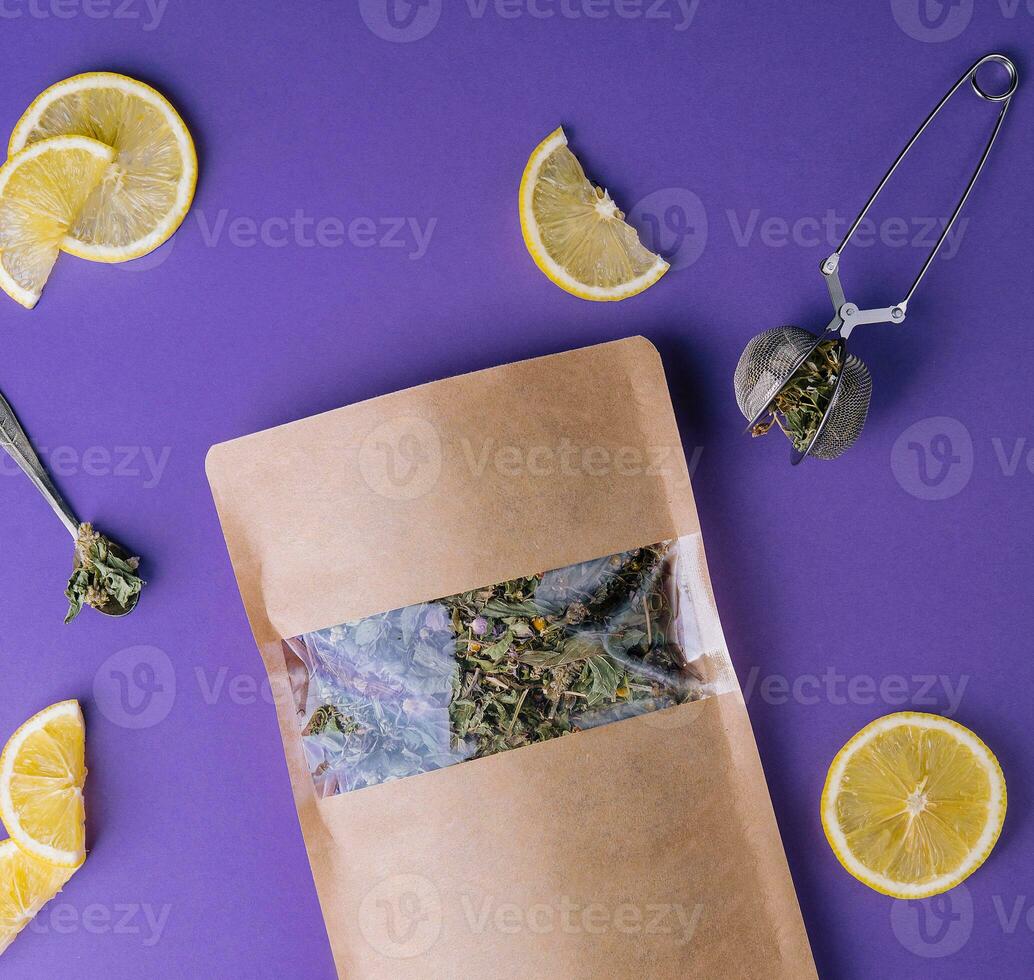Dried and fresh tea leaves with lemon slices photo