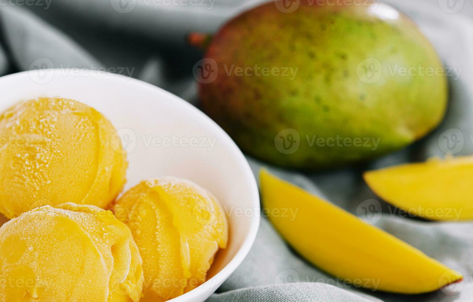 Mango ice cream with mango pieces photo