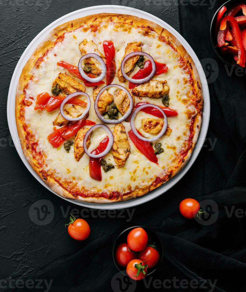 Fresh barbecue chicken pizza with vegetables photo