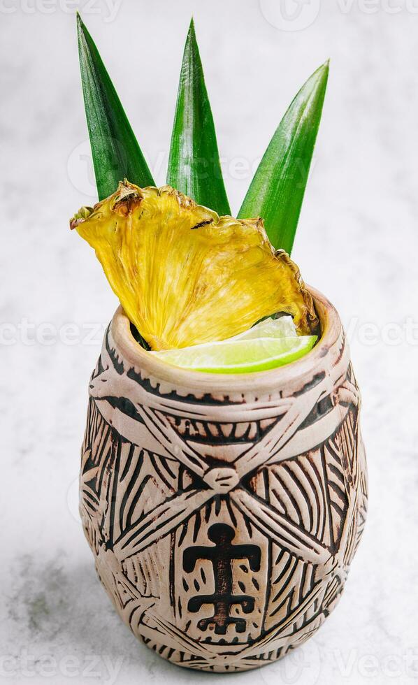 Tropical pineapple cocktail drink with lime photo