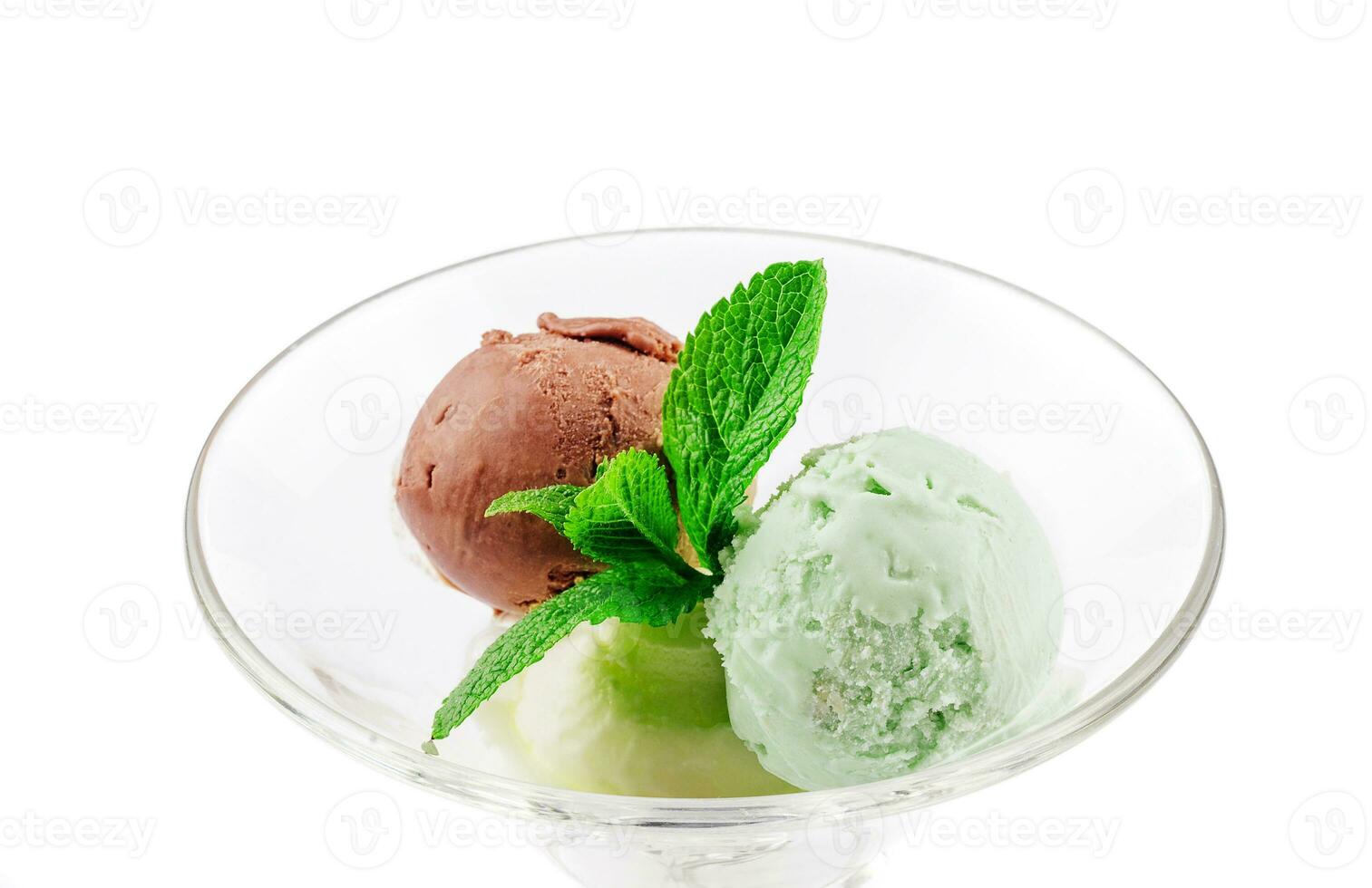 Three balls of ice cream in a transparent glass photo