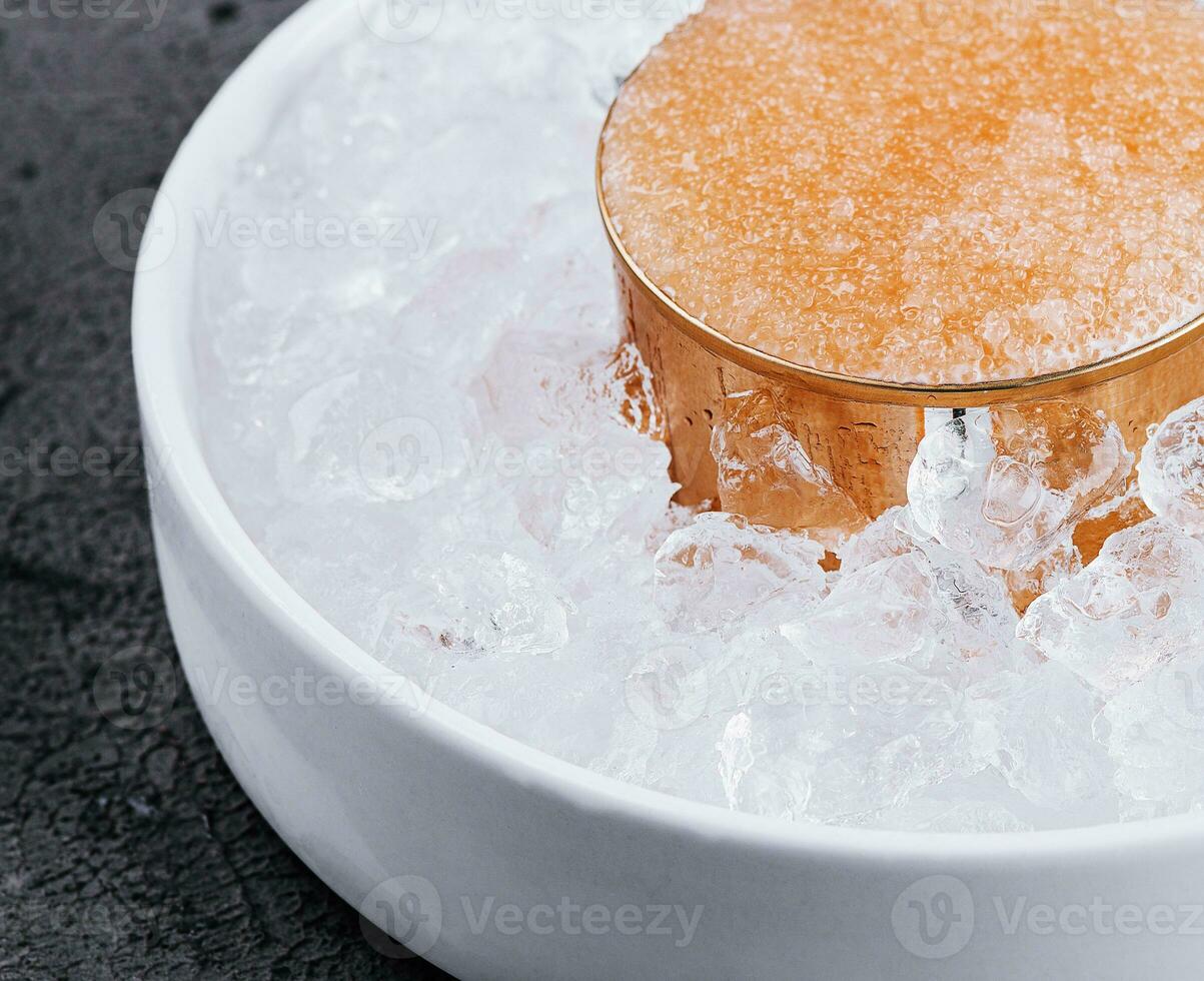 Pike caviar on ice close up photo