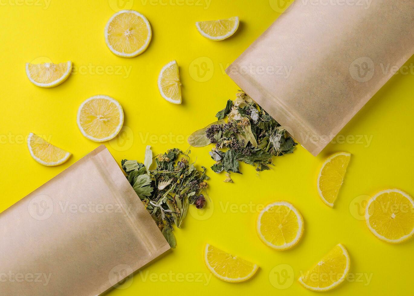 Paper bag with dry loose leaf tea with lemon slices photo