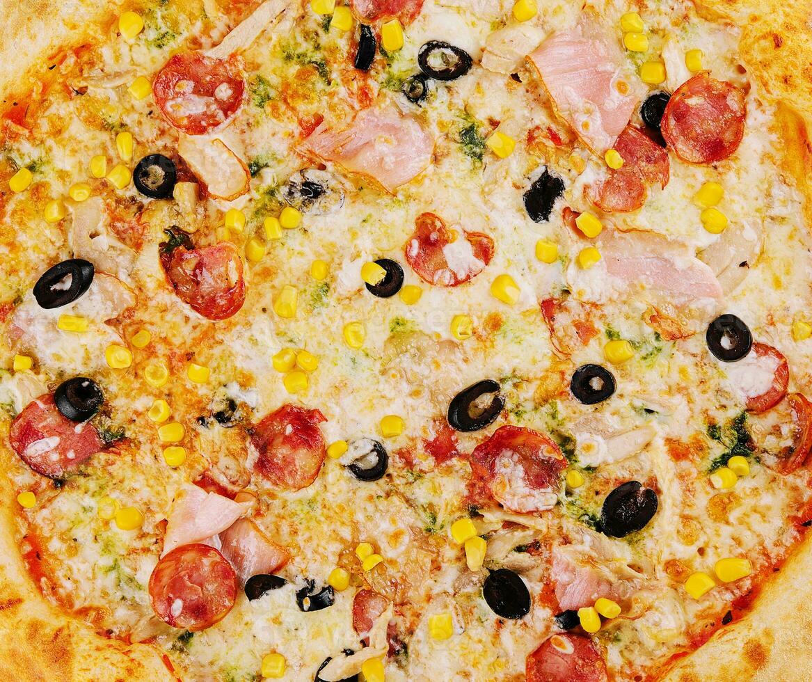 tasty pizza close up background or texture photo