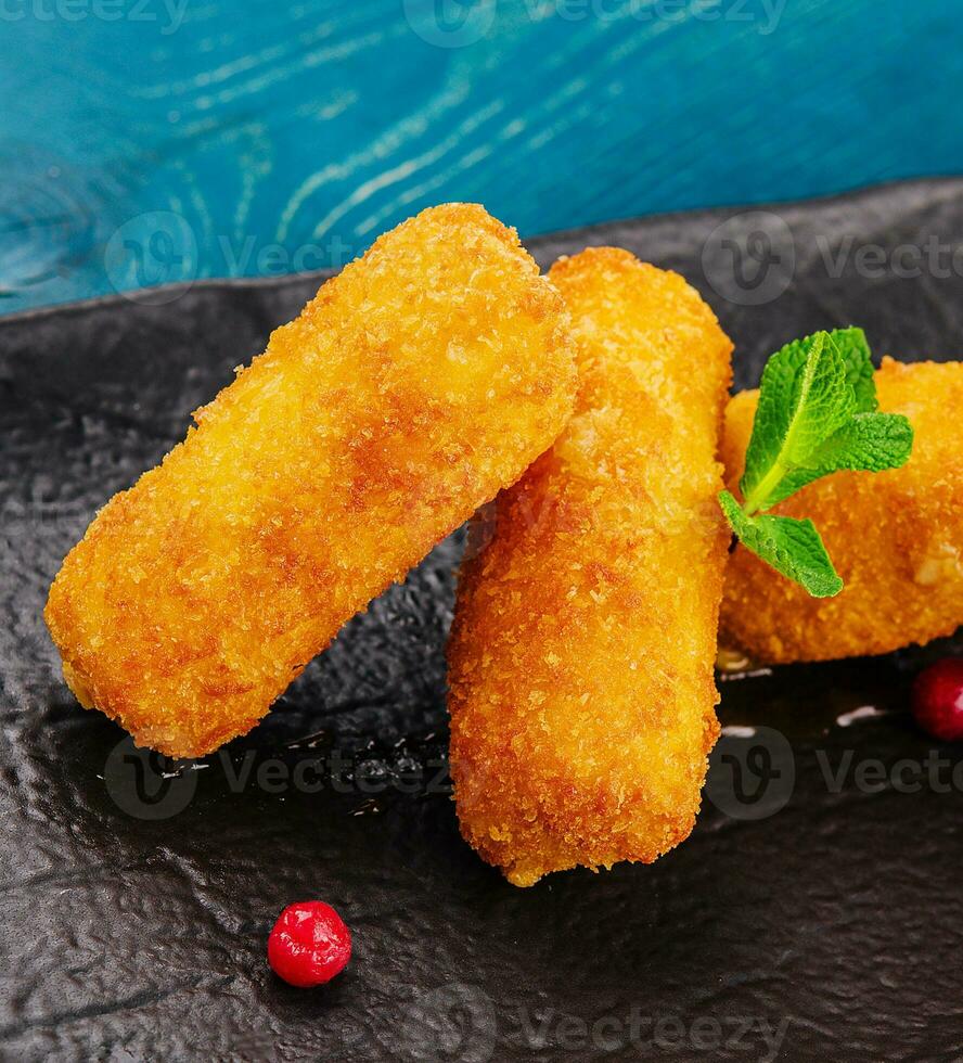 Breaded chicken strips with tomato ketchup photo